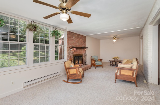 living area with a brick fireplace, ceiling fan, baseboard heating, and carpet flooring