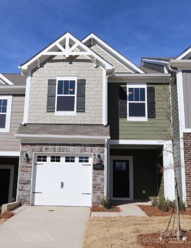 craftsman inspired home with a garage