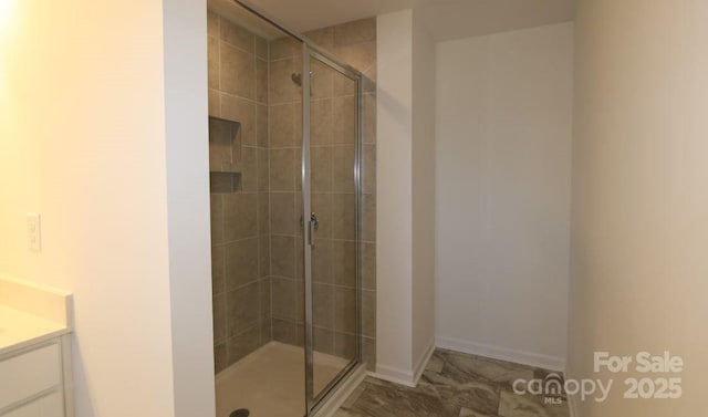 bathroom with vanity and walk in shower