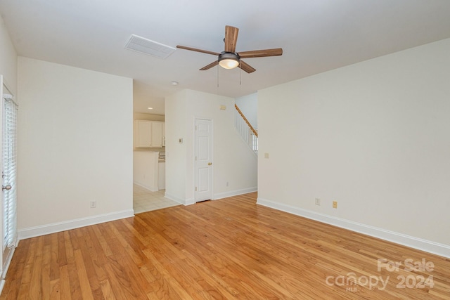 interior space featuring ceiling fan and light wood-type flooring