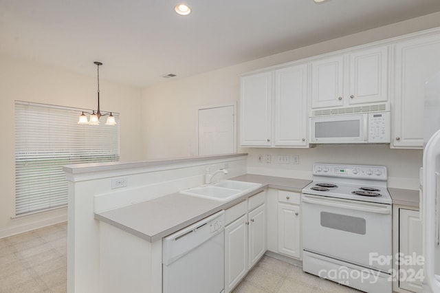 kitchen with sink, white cabinetry, decorative light fixtures, kitchen peninsula, and white appliances