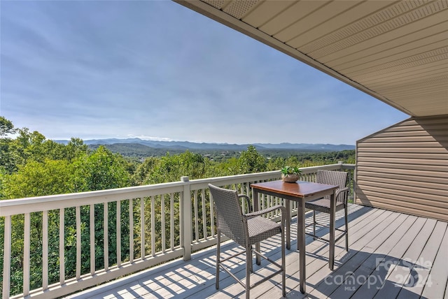 wooden deck featuring a mountain view