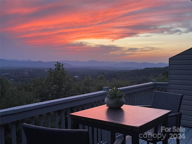 balcony at dusk with a mountain view