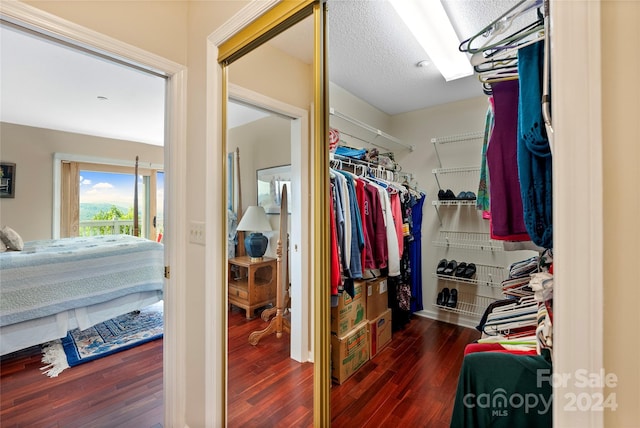 spacious closet with wood finished floors