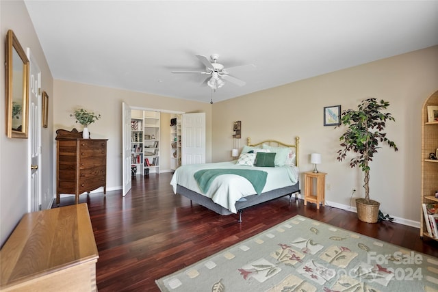 bedroom featuring wood finished floors, baseboards, a closet, and ceiling fan