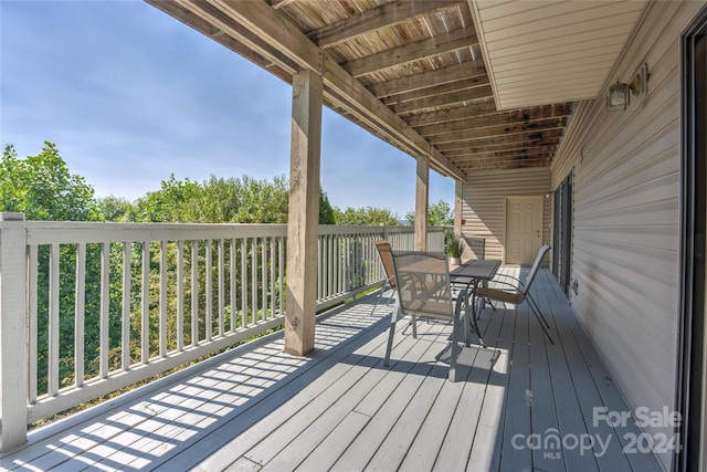 deck featuring outdoor dining area