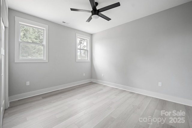 unfurnished room featuring ceiling fan and light wood-type flooring