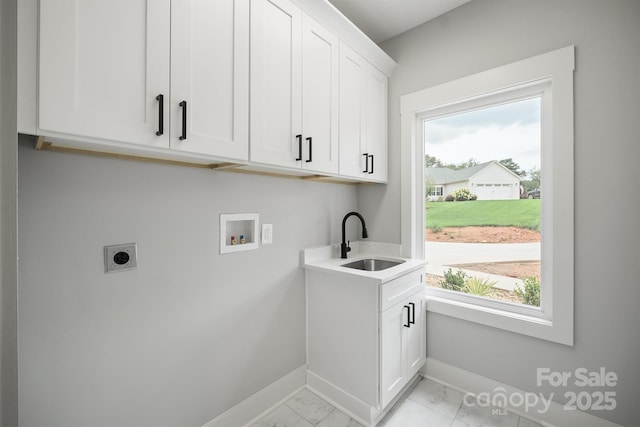 laundry room with cabinets, washer hookup, sink, and hookup for an electric dryer