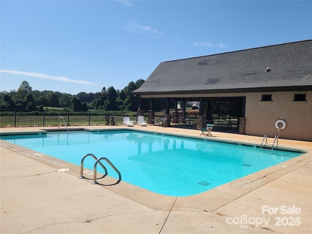 view of swimming pool featuring a patio