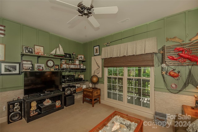 living room featuring ceiling fan and light colored carpet