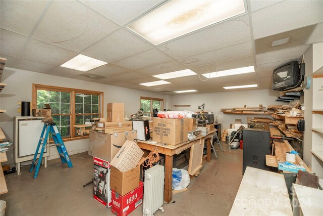 basement featuring a paneled ceiling