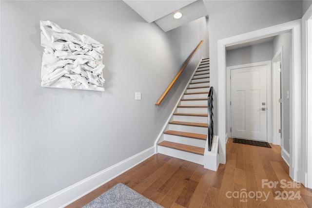 stairway featuring hardwood / wood-style floors