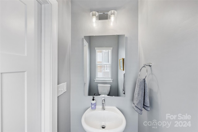 bathroom with sink and toilet