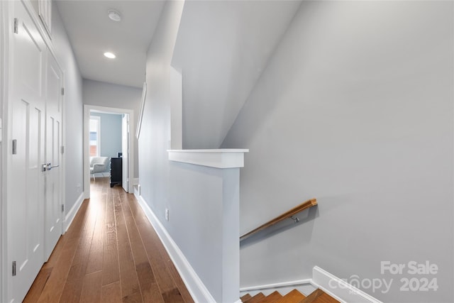 hall with hardwood / wood-style floors