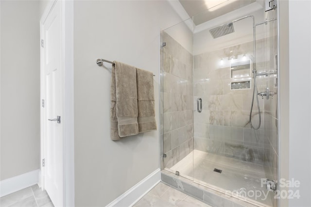 bathroom featuring tile patterned flooring and walk in shower