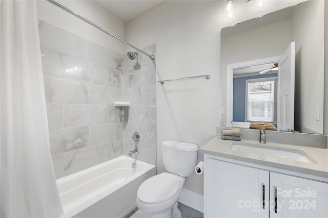 full bathroom with vanity, toilet, and shower / bath combination with curtain