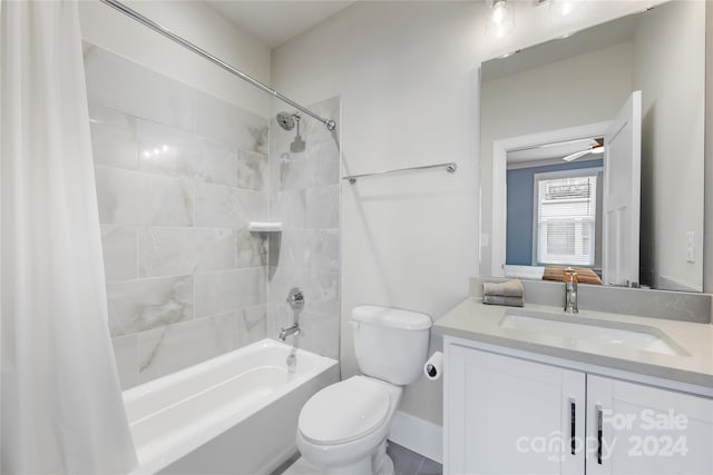 full bathroom featuring shower / tub combo with curtain, vanity, and toilet