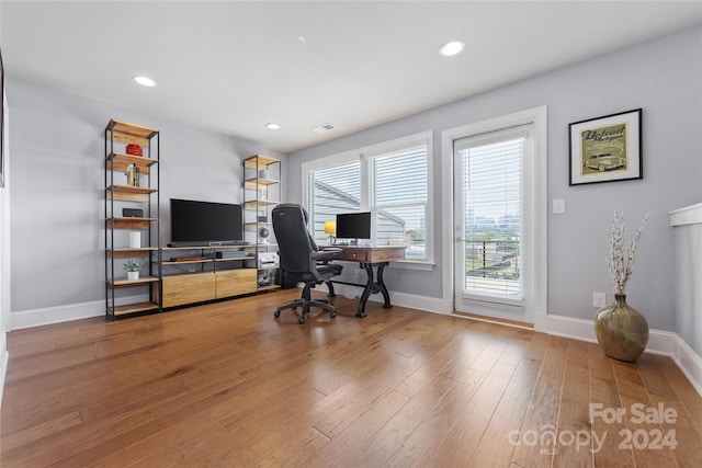 office space with hardwood / wood-style floors