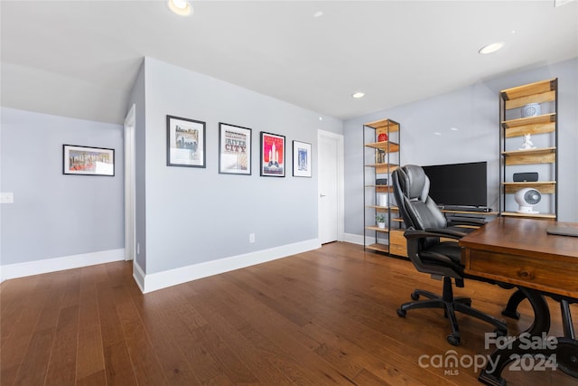 home office with dark hardwood / wood-style floors