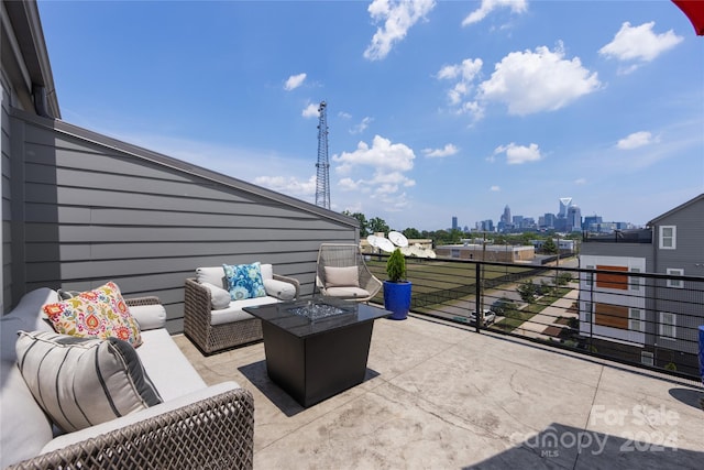 view of patio featuring a balcony and an outdoor hangout area