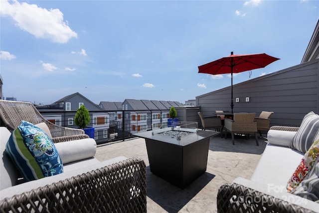 view of patio / terrace featuring an outdoor living space with a fire pit