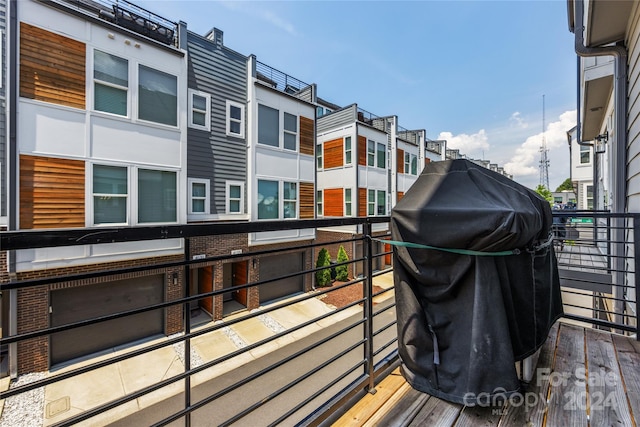 wooden terrace featuring grilling area