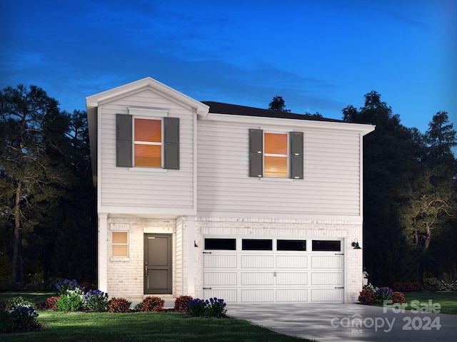 view of front facade with brick siding, driveway, and an attached garage