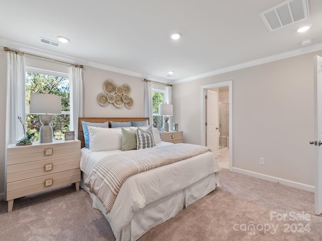 bedroom with crown molding, visible vents, and light colored carpet