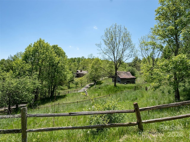 view of yard with a rural view