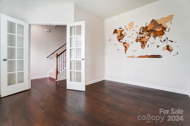 unfurnished room featuring wood-type flooring and french doors