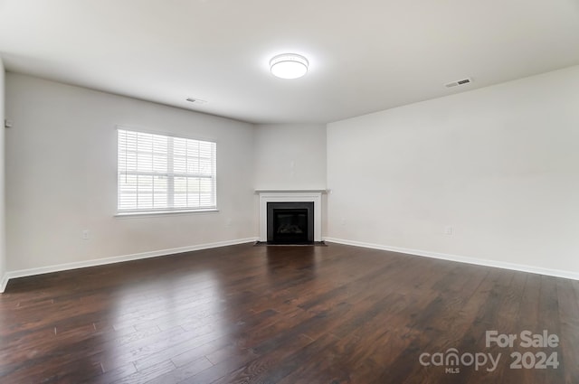 unfurnished living room with hardwood / wood-style flooring