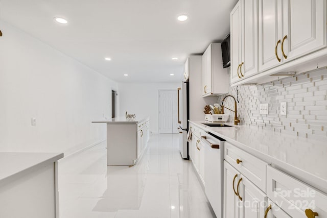 kitchen with decorative backsplash, white cabinetry, sink, light tile patterned floors, and white appliances