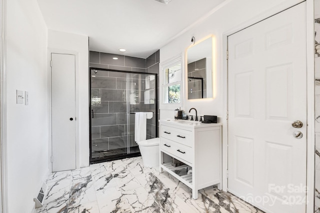 bathroom with toilet, tile patterned flooring, vanity, and a shower with shower door