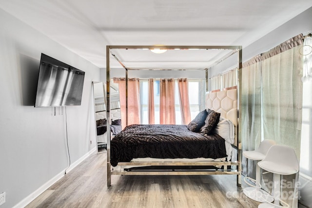 bedroom with wood-type flooring