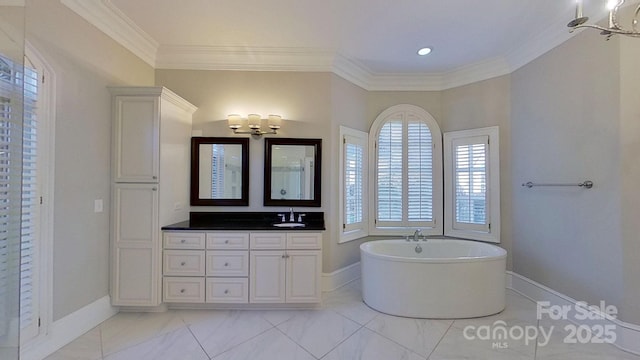 full bathroom featuring ornamental molding, a soaking tub, vanity, and baseboards