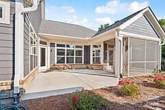 rear view of property with a patio area