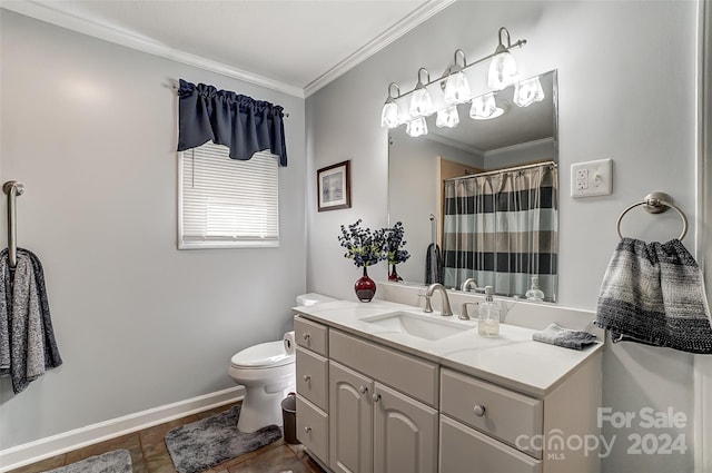 bathroom featuring ornamental molding, vanity, tile patterned flooring, and toilet