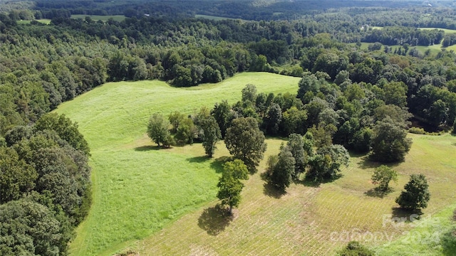 birds eye view of property featuring a rural view