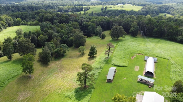 birds eye view of property with a rural view