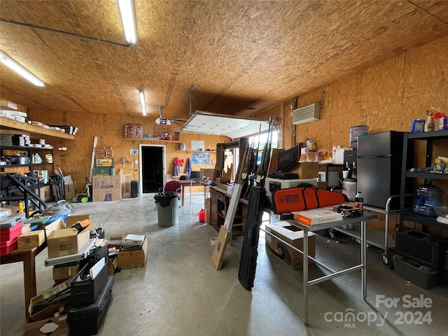 interior space with a workshop area and a garage door opener