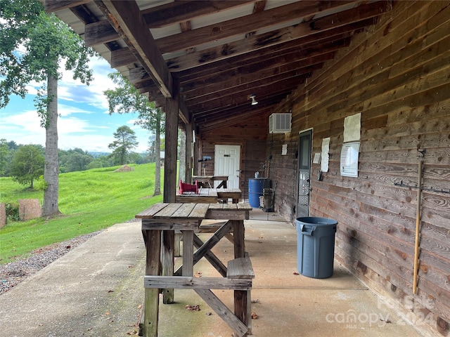 view of patio / terrace with a wall mounted AC