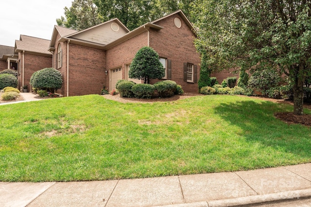 view of front facade featuring a garage and a front lawn