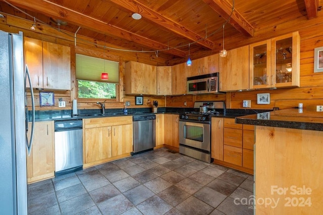 kitchen featuring pendant lighting, beamed ceiling, sink, stainless steel appliances, and wooden ceiling