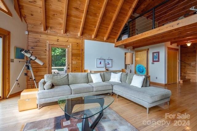 living room with high vaulted ceiling, hardwood / wood-style floors, and wood ceiling