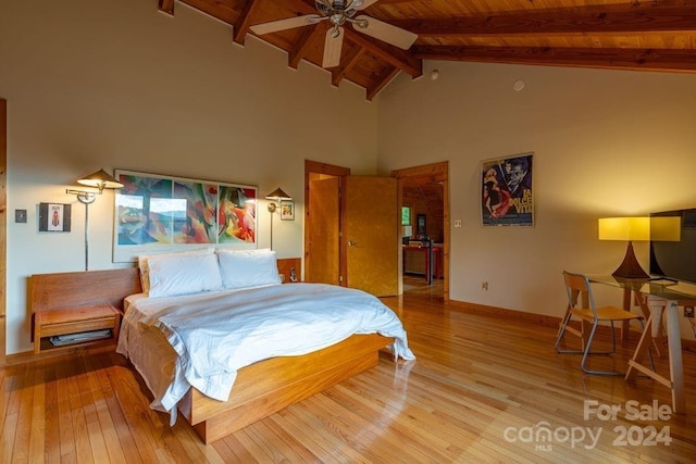 bedroom featuring beam ceiling, high vaulted ceiling, wooden ceiling, and light hardwood / wood-style floors