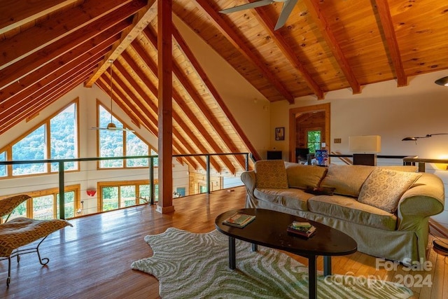 living room with beamed ceiling, ceiling fan, high vaulted ceiling, and hardwood / wood-style flooring