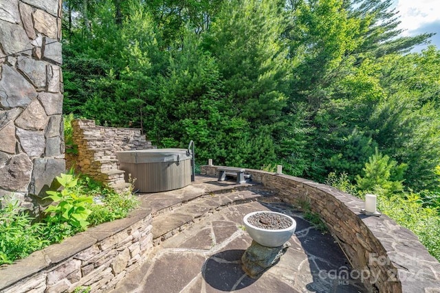 view of patio featuring a hot tub