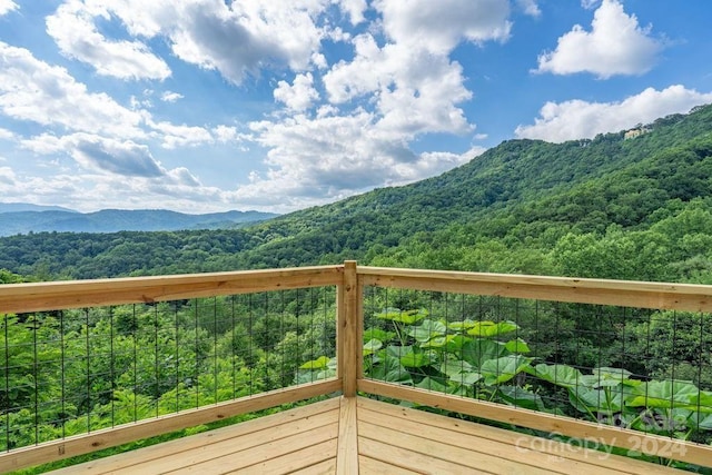 wooden terrace with a mountain view