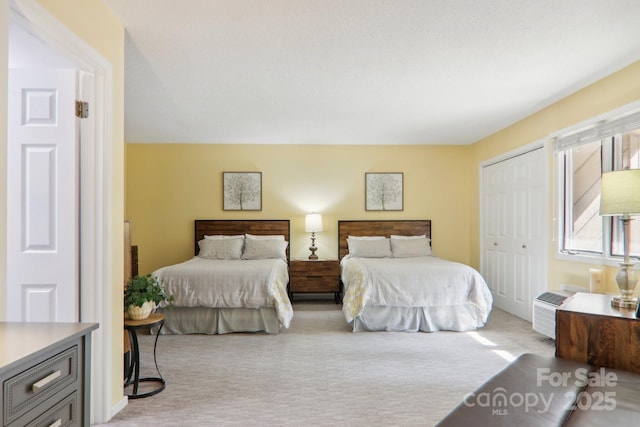 carpeted bedroom with a closet