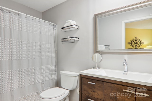 bathroom with vanity and toilet